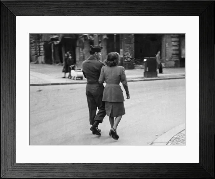 Framed Print : An American soldier walks arm in arm with a German civilian in Allied occupied Berlin Framed Print : An American soldier walks arm in arm with a German civilian in Allied occupied Berlin