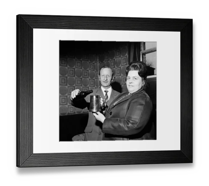 Framed Print : Pub landlord presents a tankard to a widow, Teesside. 1974 Framed Print : Pub landlord presents a tankard to a widow, Teesside. 1974