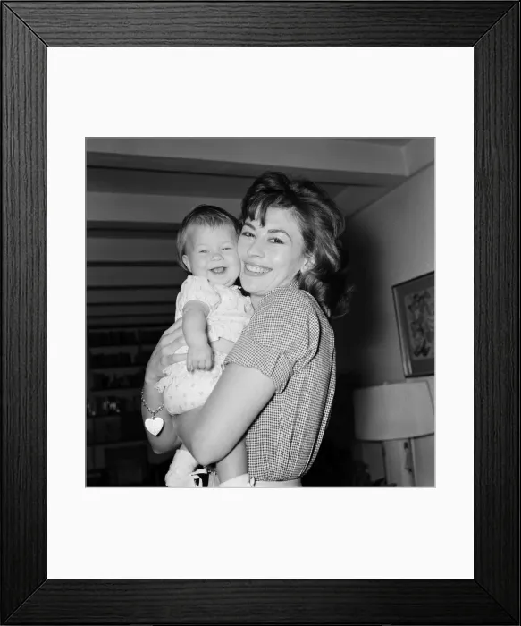Framed Print : Actress Nanette Newman with her baby daughter Sarah Kate at their home in Virginia Water Framed Print : Actress Nanette Newman with her baby daughter Sarah Kate at their home in Virginia Water