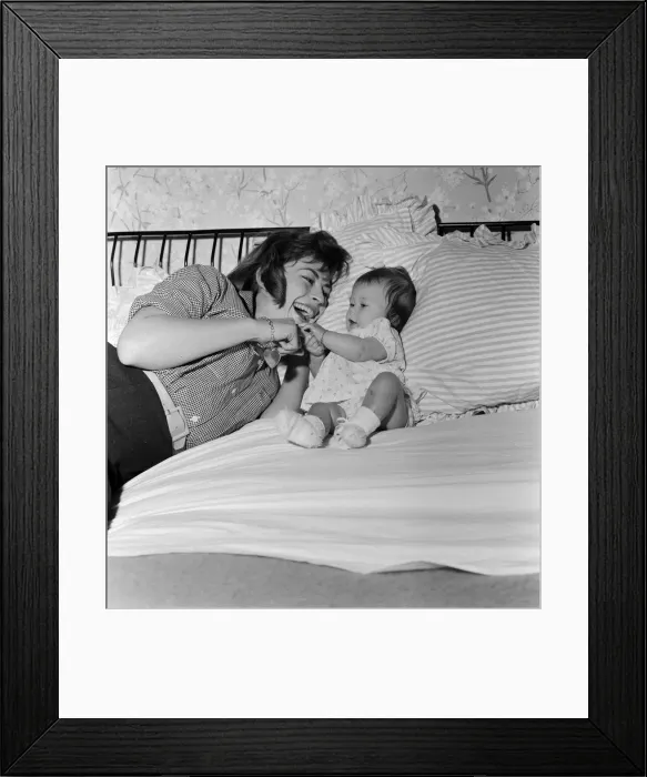 Framed Print : Actress Nanette Newman with her baby daughter Sarah Kate at their home in Virginia Water Framed Print : Actress Nanette Newman with her baby daughter Sarah Kate at their home in Virginia Water