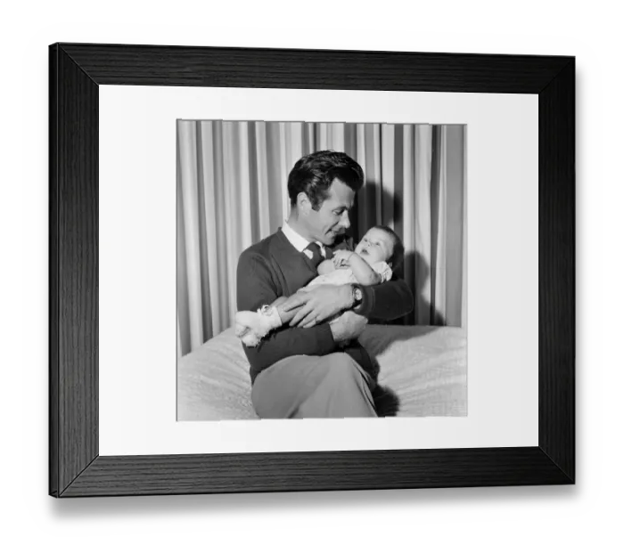 Framed Print : Bryan Forbes with his baby daughter Sarah Kate, at their home in Virginia Water, Surrey Framed Print : Bryan Forbes with his baby daughter Sarah Kate, at their home in Virginia Water, Surrey