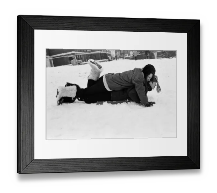 Framed Print : A couple sledging in Greenwich Park, London, 27th December 1970 Framed Print : A couple sledging in Greenwich Park, London, 27th December 1970