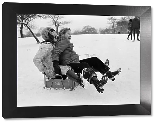 Children sledging on a milk crate in Greenwich Park, London, 27th December 1970