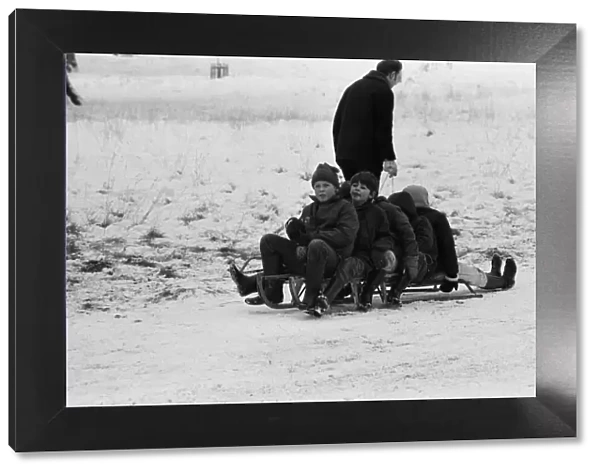 General views of tobogganing and skiing in Richmond Park, London. 27th December 1970
