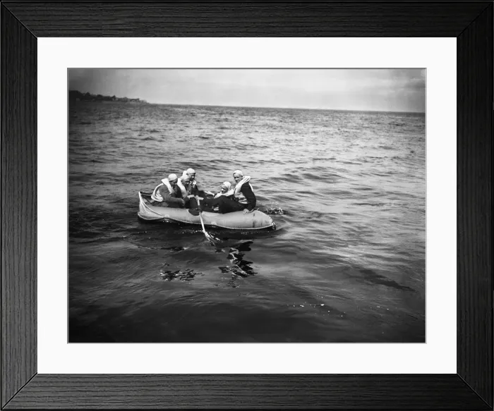Framed Print : Training exercise for the Air Sea Rescue in the Solent. A downed fight pilot climbs Framed Print : Training exercise for the Air Sea Rescue in the Solent. A downed fight pilot climbs