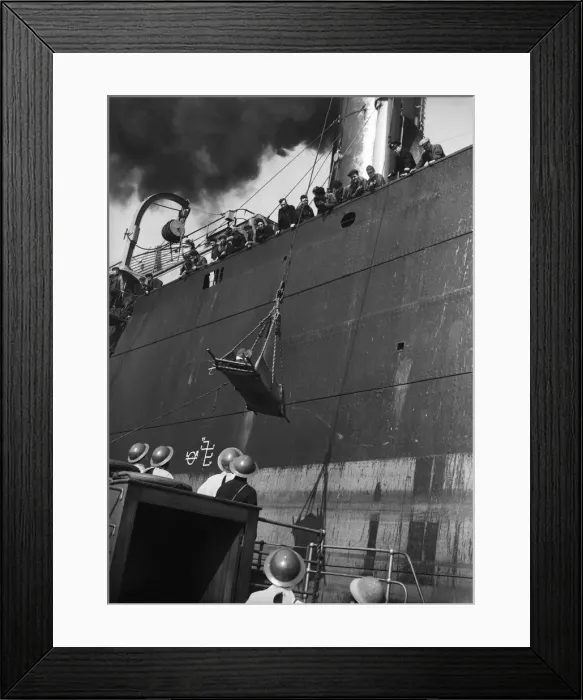 Framed Print : Injury merchant sailor being winched down to a launch during the Second World War Framed Print : Injury merchant sailor being winched down to a launch during the Second World War