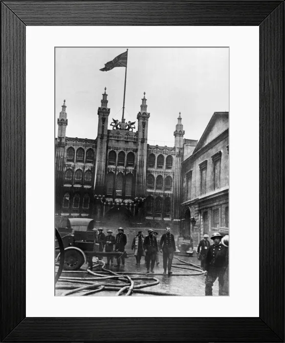 Framed Print : The Union Jack flies over the Guildhall in London which was heavily damaged in an air