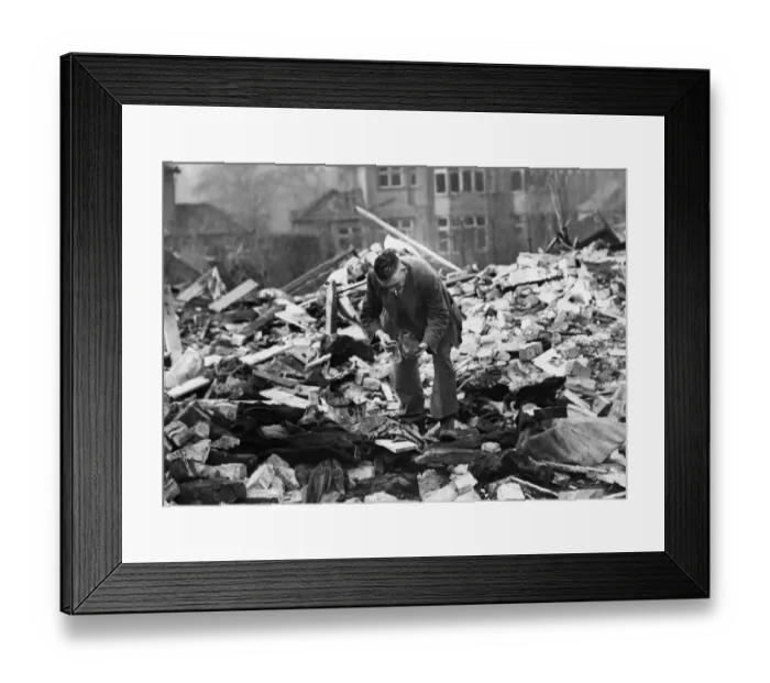 Framed Print : A man searches among the debris of his destroyed home in Wavertree Framed Print : A man searches among the debris of his destroyed home in Wavertree