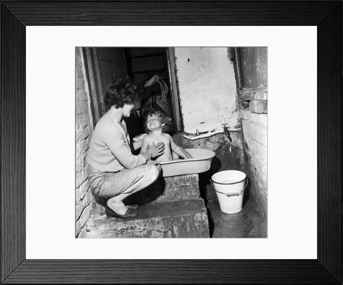 Framed Print : Slum housing, Ellison Street, Liverpool. Two-year-old Jean Ann Jameson takes a bath Framed Print : Slum housing, Ellison Street, Liverpool. Two-year-old Jean Ann Jameson takes a bath