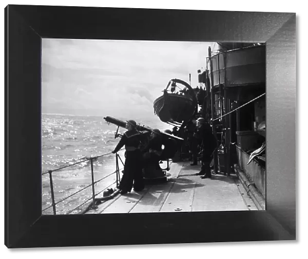Anti aircraft drill aboard a Royal Navy cruiser of the Home Fleet seen here on exercise
