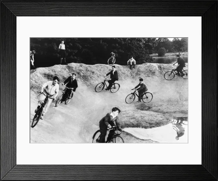 Framed Print : Children cycling around a crater on a bomb site during Second World War. Circa 1944 Framed Print : Children cycling around a crater on a bomb site during Second World War. Circa 1944
