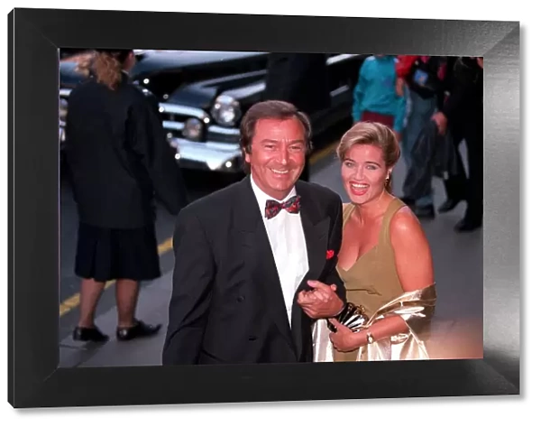 DES O CONNOR AND HIS GIRLFRIEND JAY RUFER ARRIVING AT THE PREMIERE OF SUNSET