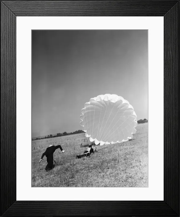 Framed Print : Fleet Air Arm parachute packers seen here testing a parachute at an un-named Royal Naval Framed Print : Fleet Air Arm parachute packers seen here testing a parachute at an un-named Royal Naval