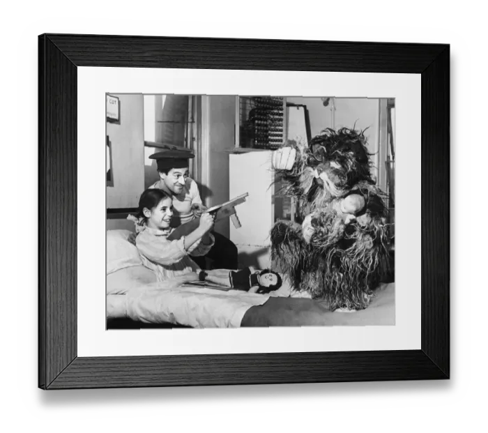 Framed Print : Stella Welsher in Charring Cross Hospital presented with a toy gun by Danny O Dare Framed Print : Stella Welsher in Charring Cross Hospital presented with a toy gun by Danny O Dare