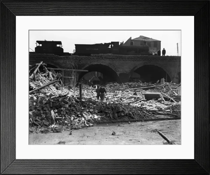 Framed Print : Workmen search through the rubble following a V2 attack on Camberwell