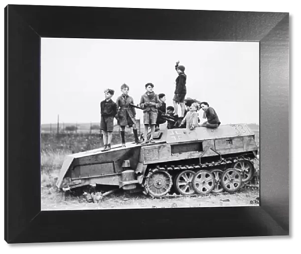Children playing on armoured Nazi vehicle during the Second World War