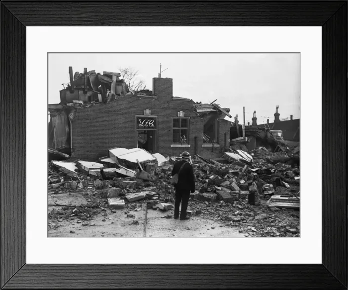 Framed Print : Workmen clear away the rubble following an air raid on Putney, London