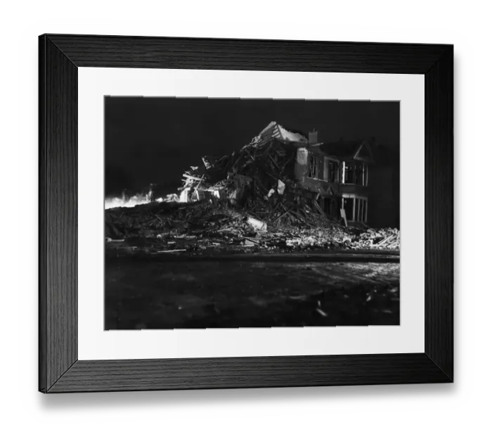 Framed Print : Rescue workers dig through the rubble after a V2 missile exploded at the junction of