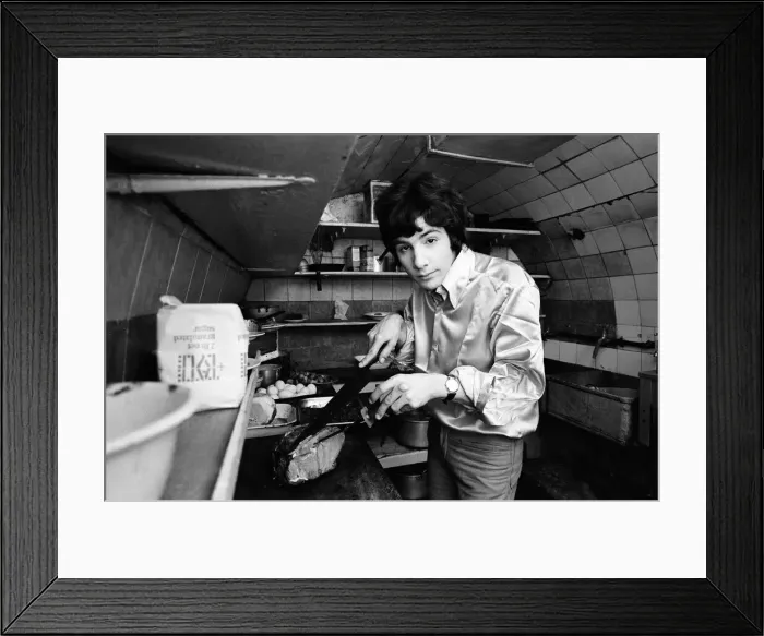 Framed Print : 18-year-old Cat Stevens in the kitchen of his Dads restaurant in Shaftesbury Avenue
