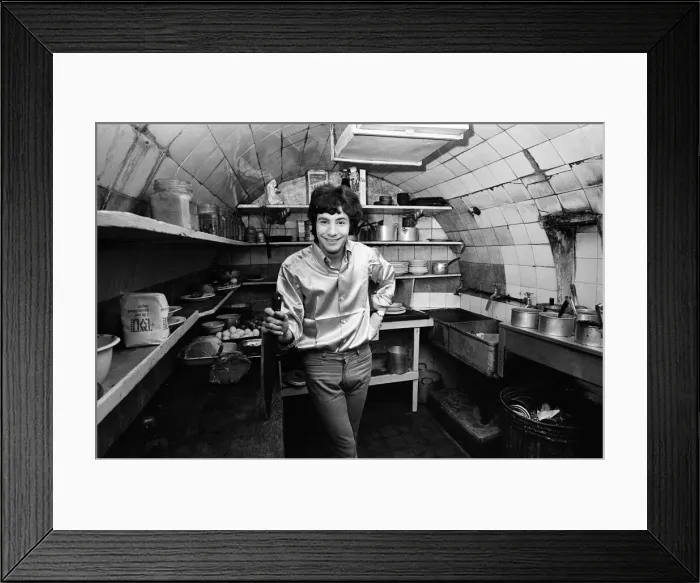 Framed Print : 18-year-old Cat Stevens in the kitchen of his Dads restaurant in Shaftesbury Avenue