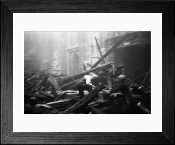 Framed Print : Salvage workers pick through the burnt out remains of London