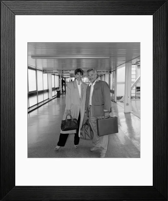 Framed Print : Actress Nanette Newman and her husband Bryan Forbes at Heathrow Airport. 3rd May 1987