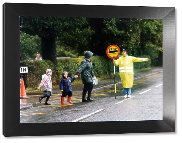 Lollipop lady Ann Liddell escorts children across Road, Stokesley, 14th September 1993