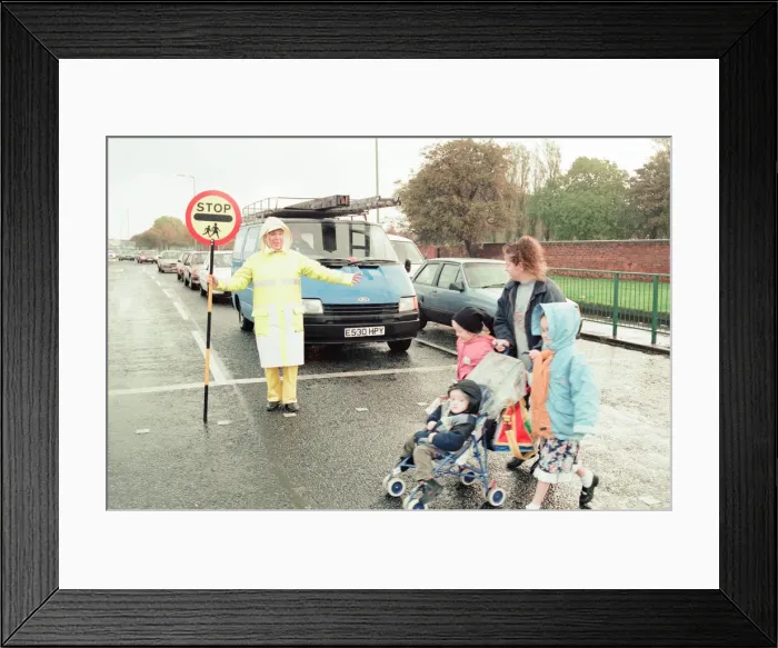Framed Print : Lollipop lady Janet Taylor on duty at the junction of Trunk Road with Kings Road Framed Print : Lollipop lady Janet Taylor on duty at the junction of Trunk Road with Kings Road