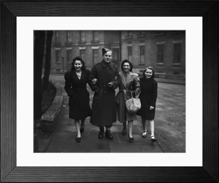 Framed Print : Repatriated wounded soldiers seen here with their families after returning home