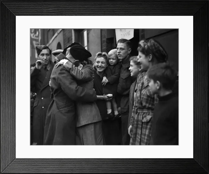 Framed Print : Repatriated wounded soldiers seen here with their families after returning home