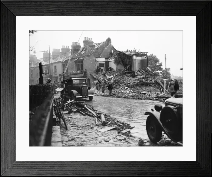 Framed Print : ARP rescue members seen here searching a shop in Bridlington damage by blast in a Framed Print : ARP rescue members seen here searching a shop in Bridlington damage by blast in a