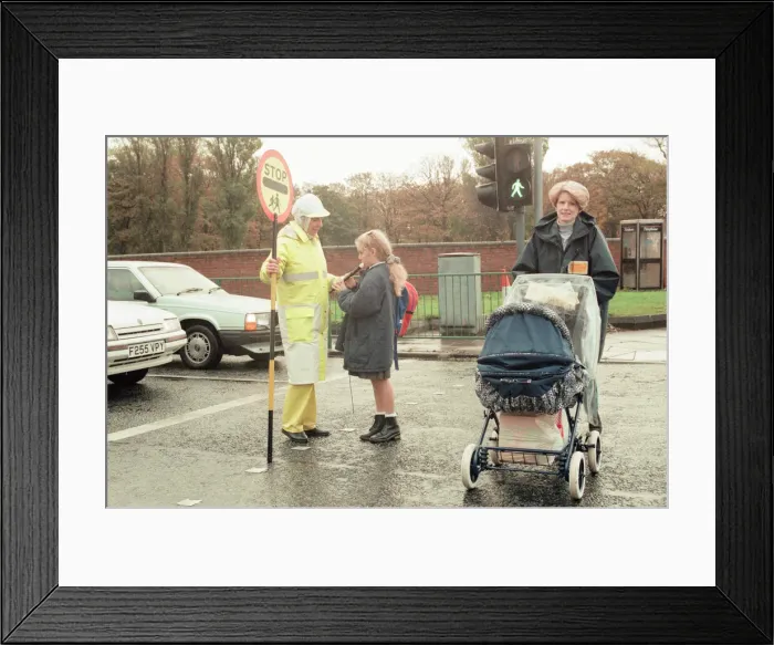 Framed Print : Lollipop lady Janet Taylor on duty at the junction of Trunk Road with Kings Road