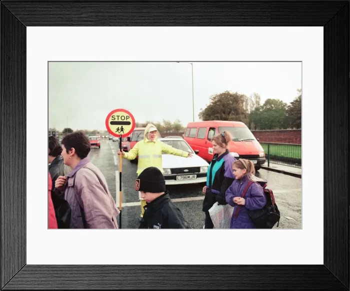 Framed Print : Lollipop lady Janet Taylor on duty at the junction of Trunk Road with Kings Road Framed Print : Lollipop lady Janet Taylor on duty at the junction of Trunk Road with Kings Road
