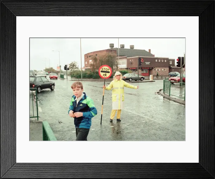 Framed Print : Lollipop lady Janet Taylor on duty at the junction of Trunk Road with Kings Road Framed Print : Lollipop lady Janet Taylor on duty at the junction of Trunk Road with Kings Road