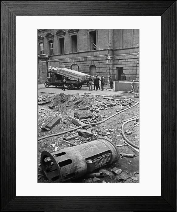 Framed Print : A small crater outside The Mansion House in the City of London which was damaged by Framed Print : A small crater outside The Mansion House in the City of London which was damaged by