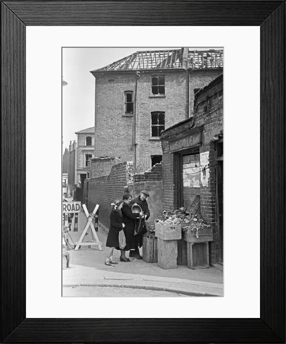 Framed Print : East End greengrocer doing his best to remain open for his customers despite
