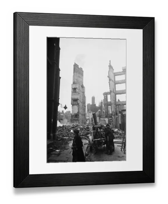 Framed Print : Firemen dampening down the smouldering ruins in the the City of London following