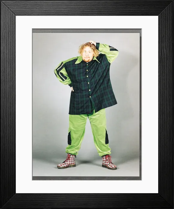 Framed Print : Ewan MacLeod in green and tartan suit scratching his head Framed Print : Ewan MacLeod in green and tartan suit scratching his head