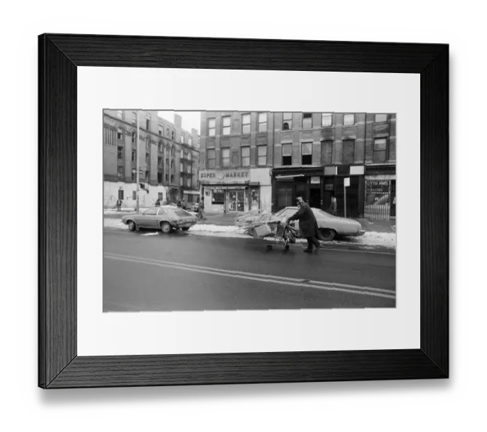 Framed Print : A man pushing a shopping trolley in the road in New York. 13th February 1981