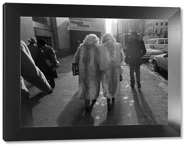Street scene in New York, two women wearing fur coats walking down the street