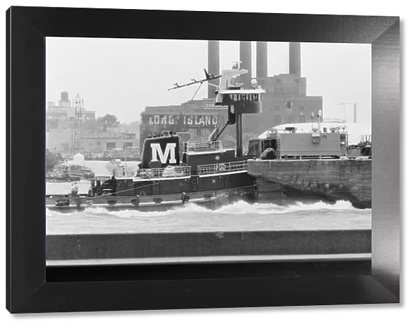 Tug in Long Island Sound with Schwartz Chemical Company building on Long Island City seen