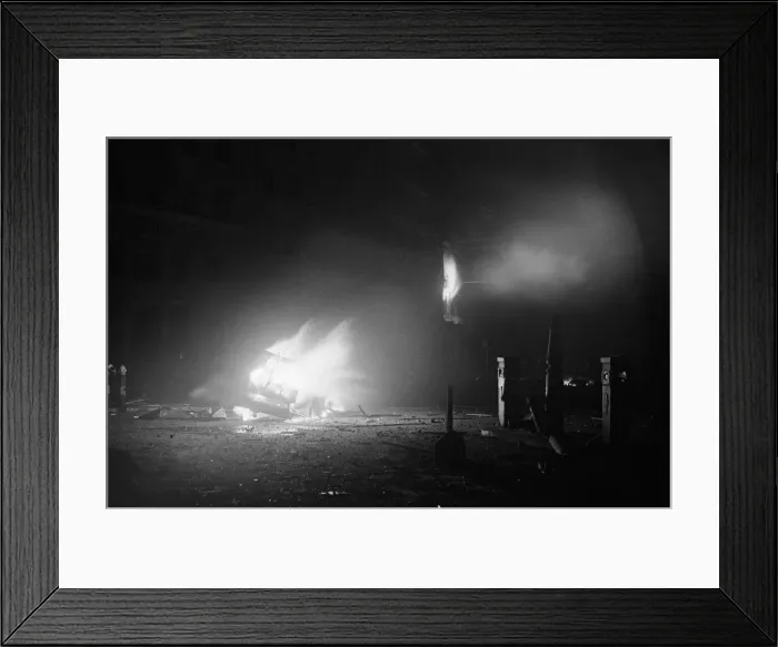 Framed Print : The wreckage of a car a blaze after being hit by a bomb Framed Print : The wreckage of a car a blaze after being hit by a bomb