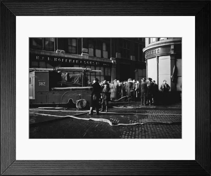 Framed Print : Members of the Auxiliary Fire Service and London Fire Brigade seen here fighting a fire