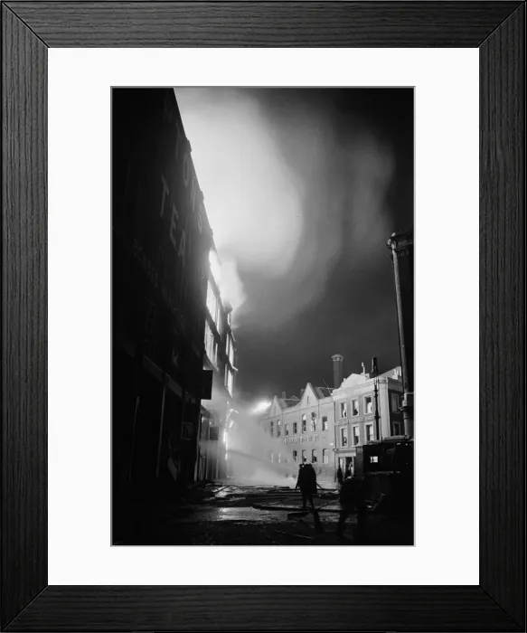 Framed Print : Members of the Auxiliary Fire Service and London Fire Brigade seen here fighting a fire