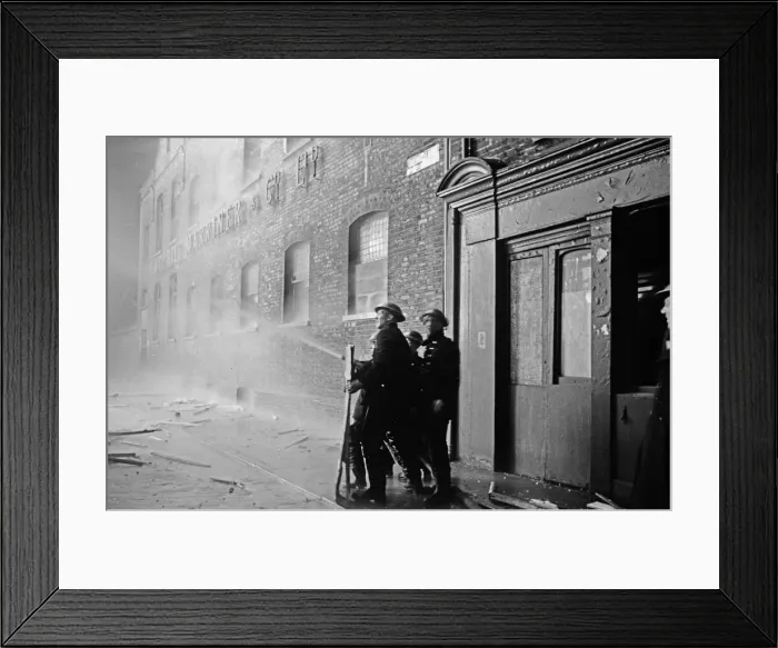 Framed Print : Members of the Auxiliary Fire Service and London Fire Brigade seen here fighting a fire