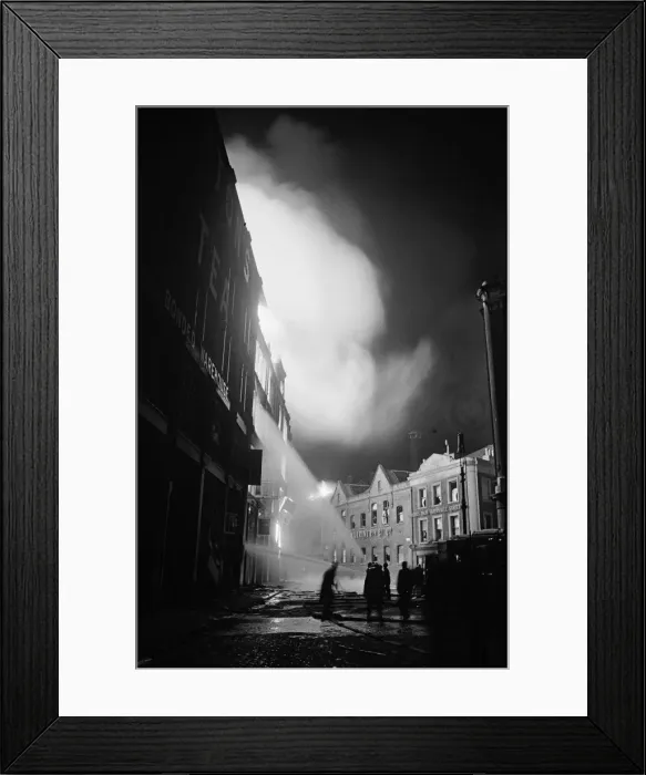 Framed Print : Members of the Auxiliary Fire Service and London Fire Brigade seen here fighting a fire