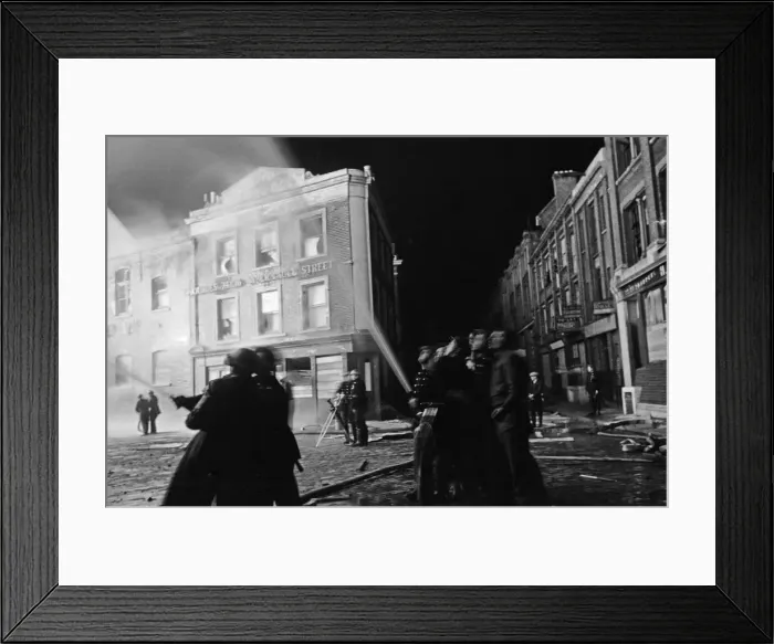 Framed Print : Members of the Auxiliary Fire Service and London Fire Brigade seen here fighting a fire