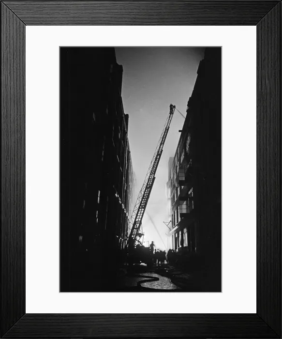 Framed Print : Firemen attempt to control fires in Shoreditch, London, during an air raid on the city