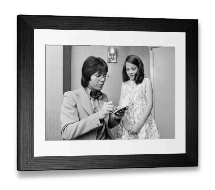 Framed Print : Cliff Richard signing autograph for a young fan, he is starring in Take Me High Framed Print : Cliff Richard signing autograph for a young fan, he is starring in Take Me High