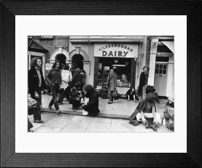 Framed Print : Reading pop festival goers seen here stopping off at the Silverbourne Dairy Framed Print : Reading pop festival goers seen here stopping off at the Silverbourne Dairy